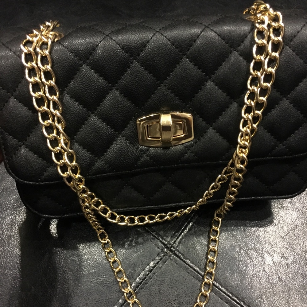Quilted black and gold express pocketbook